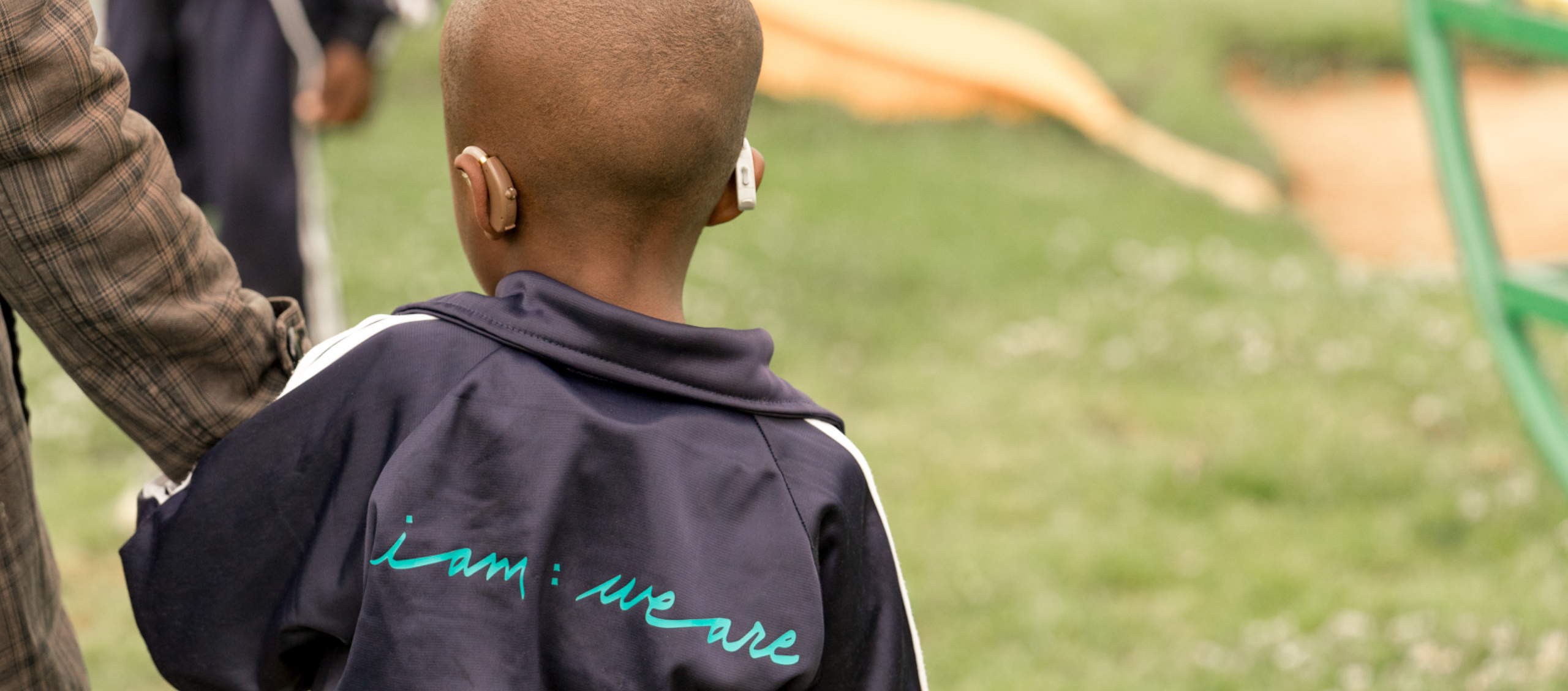 Back of child's head wearing hearing aids