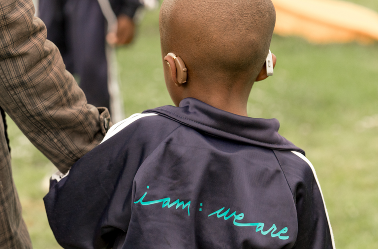 Back of child's head wearing hearing aids